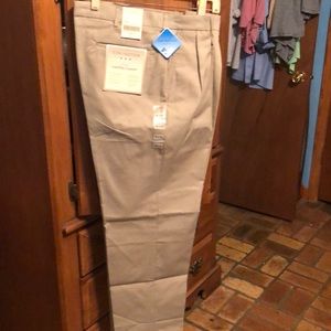 Men’s pants 36W 30L.  One dark green one tan both are new only one with tags